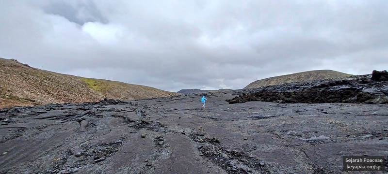 Hiking on solidified lava from the 2021 eruption at Fagradalsfjall, near Grindavik.